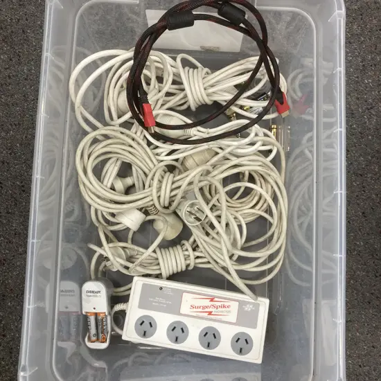 Bin of Power Extension Leads, Battery Charger & Batteries, Surge / Spike Protector, HDMI Lead, Etc