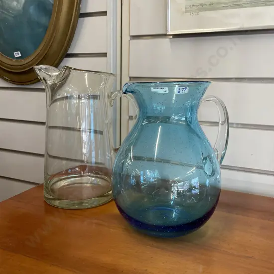 Modern Art Glass Water Jugs 1x Blue H24cm, 1x Clear Glass H26cm.
