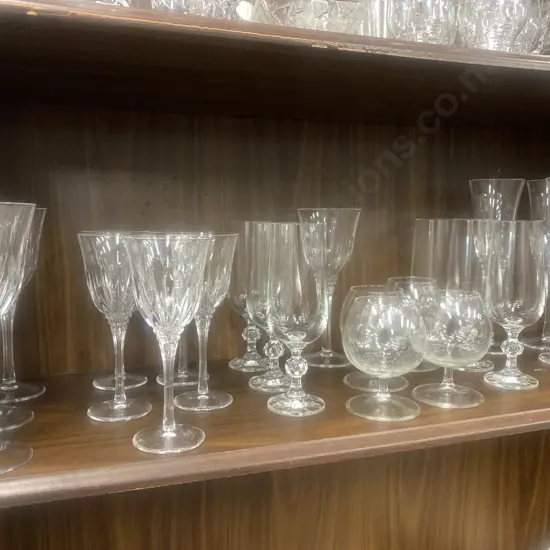 Assortment Of Crystal Glasses Including Champagne, Wine, And Brandy.