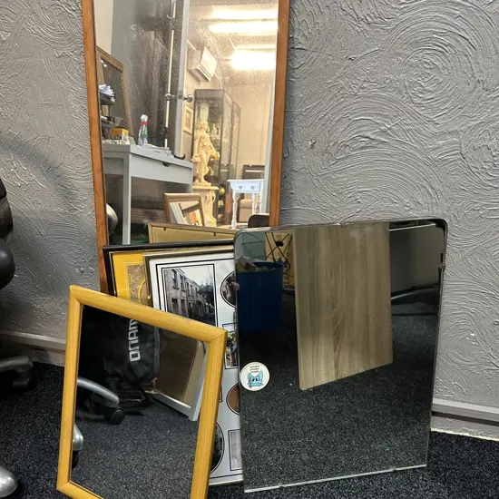 Selection Of Mirrors And Photo Frames