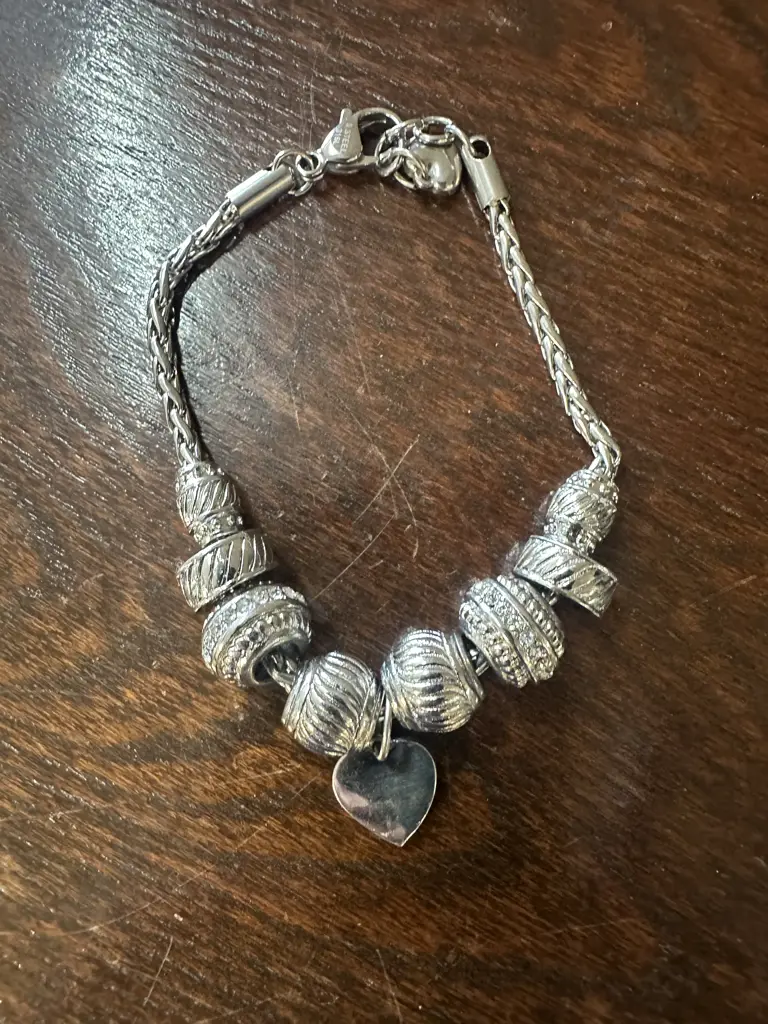 Silver Coloured Bracelet With Assorted Charms Image 1++