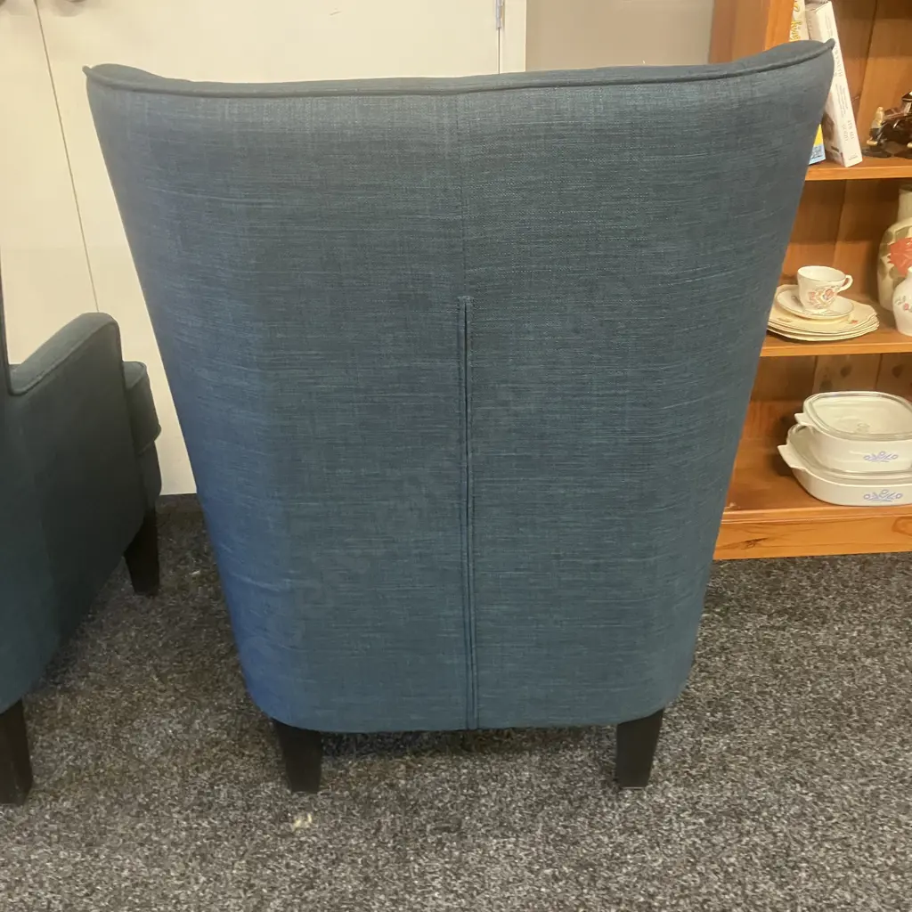 Pair of High Curved Wing Back Chairs In Blue Fabric With Black Legs Image 1++