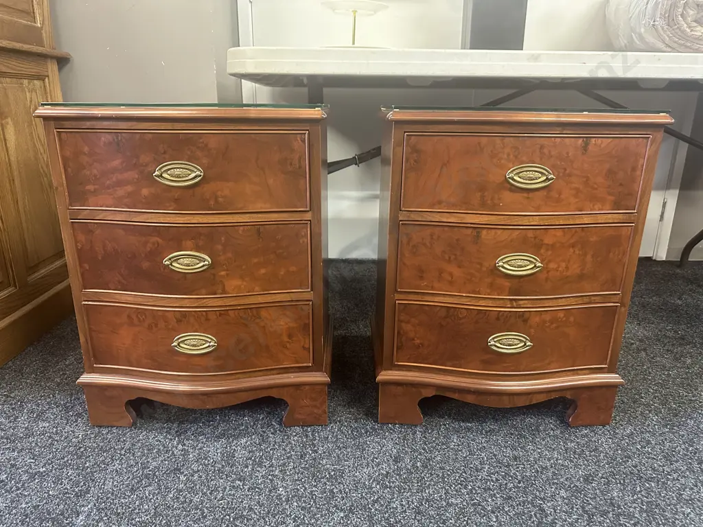 Pair Of Wooden Walnut Detailed Three Drawer Bedsides With Brass Ornate Handles & Glass Top. H62,W48,D34cm. Image 1++