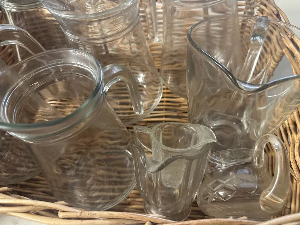 Cane Basket With Assorted Glass Pitchers & Jugs Image 1++