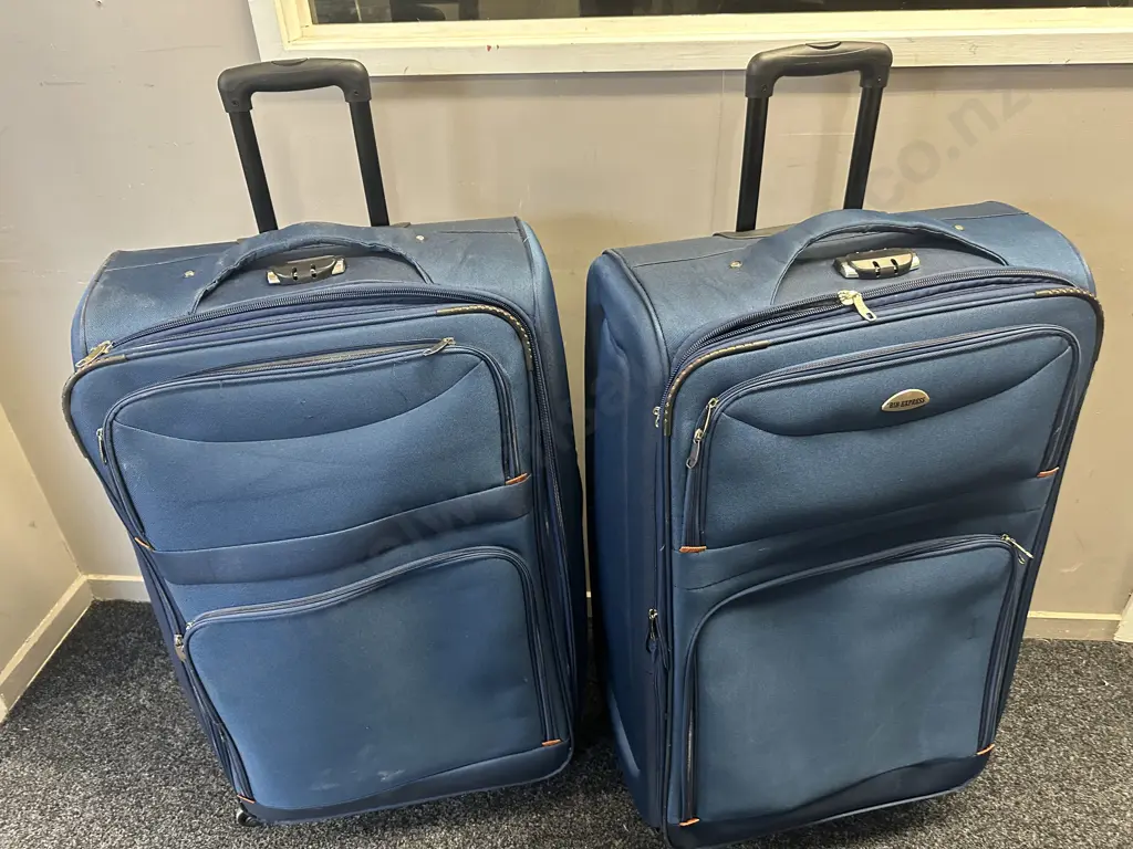 Pair Of Blue BIB Express Suitcases H88,W52cm. Image 1++