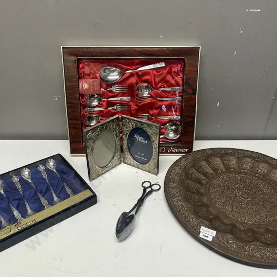 Selection Of Silverware With Copper Wall Plate