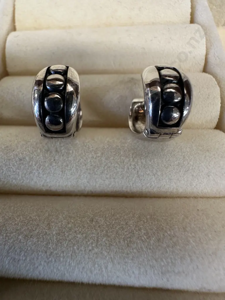 Pair Of Silver Coloured Earrings With Relief Detail Image 1++