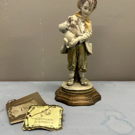 Vintage Figurine Boy Holding Dog  Signed B.Merli