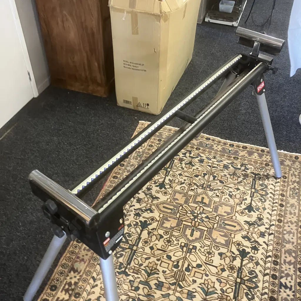 Ryobi 315mm Compound Mitre Saw Model EMS2431SCL With Ryobi AMS-02 Mitre Saw Stand With Rollers Image 1++