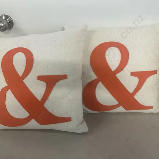 Pair Of Designer Cushions Cream Linen With Large Orange Symbol