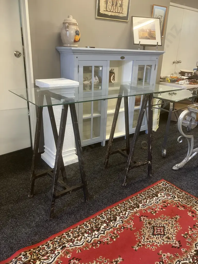 Glass Top Table On a Pair of Black Steel Trestles. H92.5 W140 D60cm Image 1++