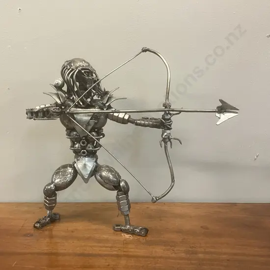 Predator With Bow & Arrow Metal Sculpture. 33 x 36cm