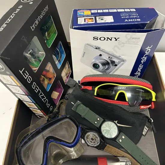 Box Lot Watches, Sunglasses, Sony Cybershot Camera, Puzzles Etc