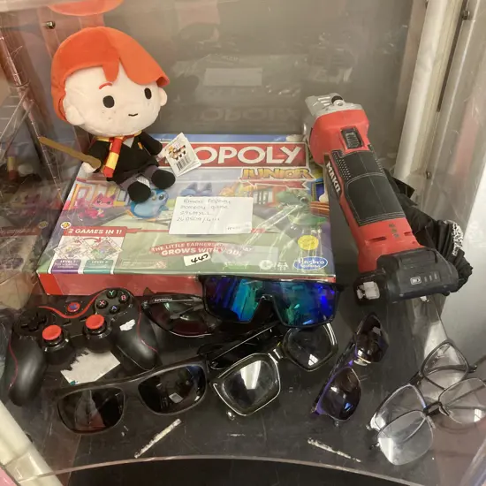 Box lot - Assorted Sunglasses, Monopoly Game, Mako Angle Grinder Etc