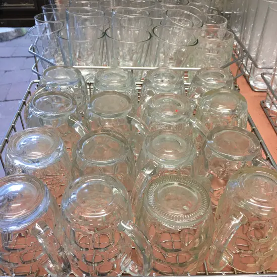 Assorted Glasses & Beer Handles In Stainless Steel Trays