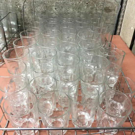 Two Stainless Steel Trays Of Glasses