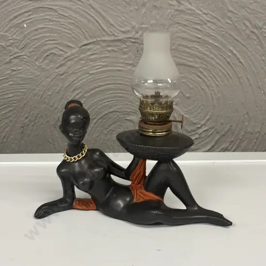 Mid Century African Lady laying with lantern
