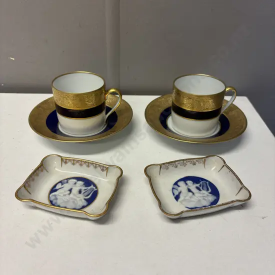 Pair of Limoge heavy gilded trim demi-tasse cups and saucers with two pate-sur-pate dishes