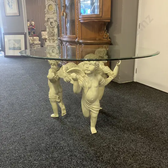 Cherub Trio Vintage Coffee Table With Round Glass Top. 76 x 137cm (As Found)