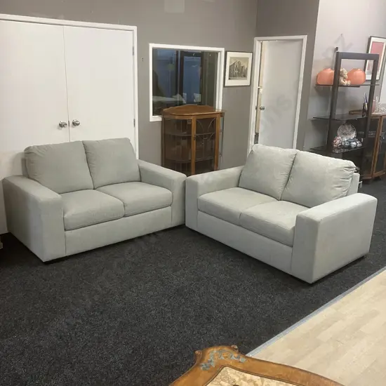 2 + 2 Seater Lounge Suite Ex Harvey Norman Upholstered In Grey Fabric With Black Wooden Feet