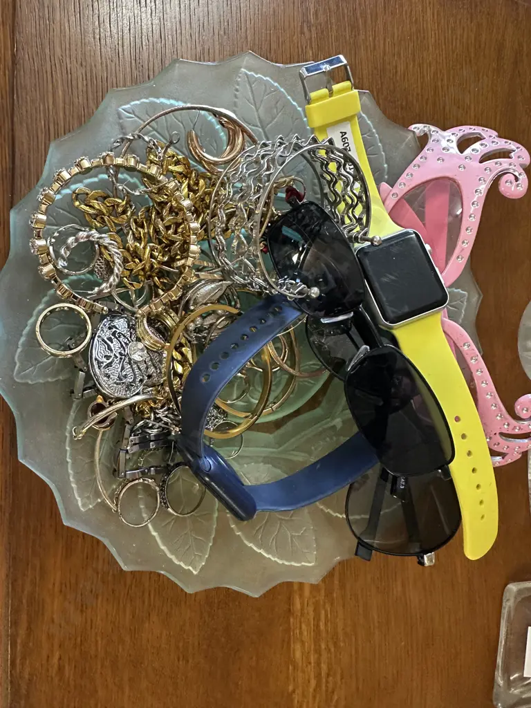 Smart Watch With Yellow Plastic Strap And Selection Of Jewellery Image 1++