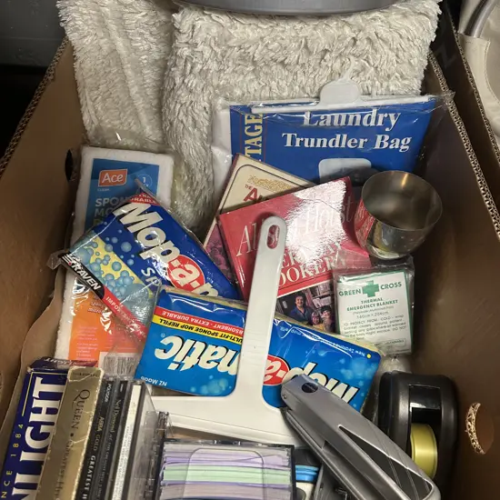 Box Lot Of Bath Mat, Laundry Trundler Bag, Mop Heads, Stationary Etc