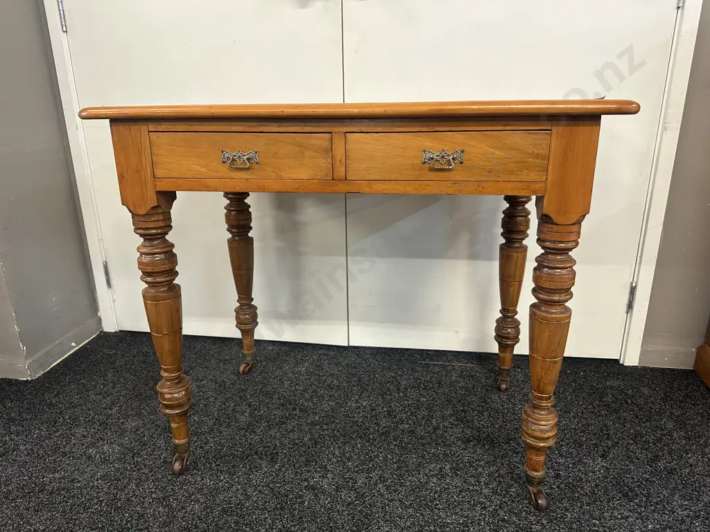 Kauri 2 Drawer Writing Table, Turned Legs, Bakelite Castors. H75 W93 D52cm Image 1++