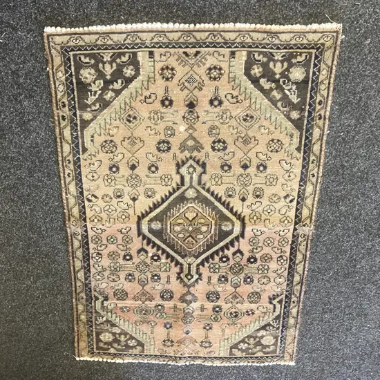 Vintage Persian Floor Rug. 85 x 125cm Black, Green, Tan Tones (Some Paint Damage)