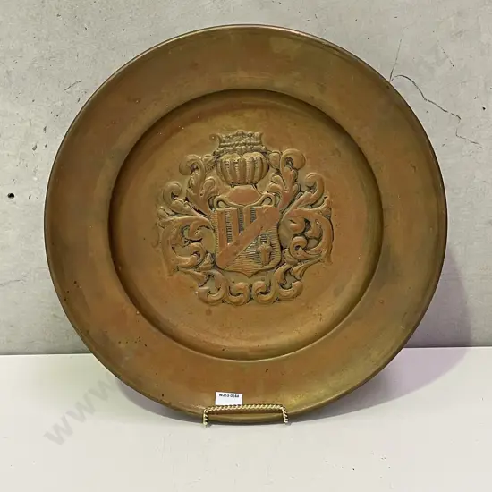 Large Copper Charger/platter with moulded crest decoration. Dia46cm
