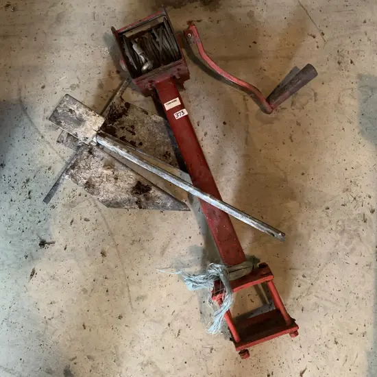 Solid red steel hand winch with boat anchor