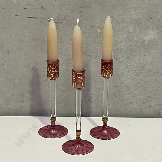 Trio Cranberry Coloured Glass Candlesticks with Gilded Decoration with Candles